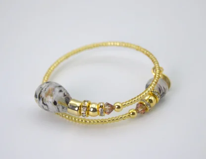 Murano wrap bracelet with gold seed beads and drop spotted blown glass beads