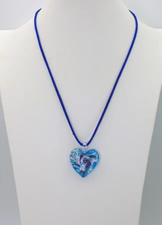 Swirls of silver on a bed of blue tones Murano glass heart, one inch wide by one inch long on 18 inch silk cord