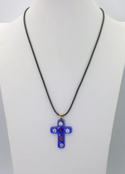 Blue Murano glass cross pendant with colorful millefiori decoration on a cotton cord