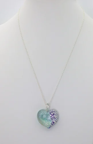 Murano Blue Silver Swirl heart pendant one inch by one inch, silver infusion on a bed of two tones of blue on an 18 silver chain