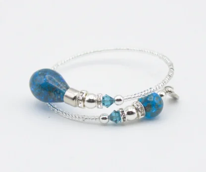 Murano wrap bracelet with silver seed beads and two lapis colored drop beads