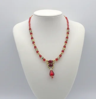 Red and clear Murano glass bead necklace with intricate detail and a two inch drop bead