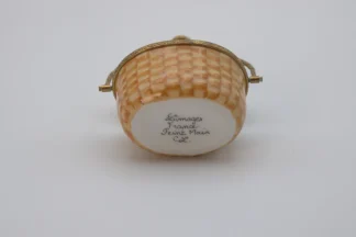 Miniature Limoges Nantucket basket with clipper ship panel and gold trim and handle bottom view