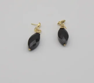 Murano black faceted drop earring with gold details. Shiny black drop earring on studs