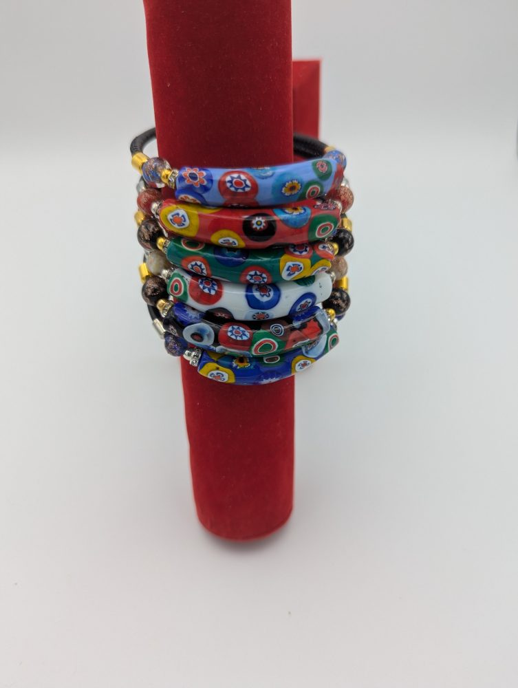 Murano Millefiori flower wrap bracelets in various colors stacked.