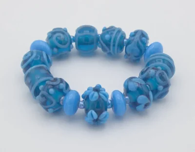 Stretch bracelet turquoise Murano glass hand made extra fancy beads with floral and other patterns on hand blown beads