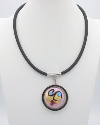 Pink Murano glass Miro style surreal lady face round pendant in a silver frame on a rubber cord with stainless steel bail