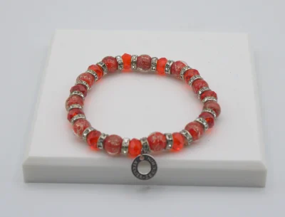 Red Murano glass bead stretch bracelet with bling and a charm