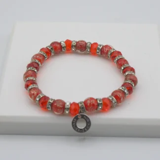 Red Murano glass bead stretch bracelet with bling and a charm