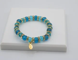 Turquoise Murano glass bead stretch bracelet with bling and a charm