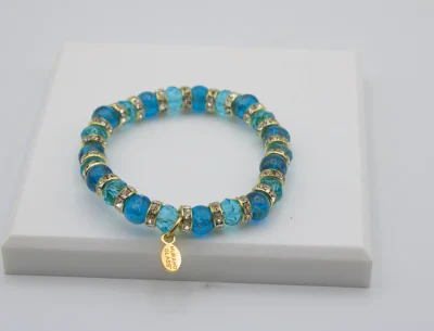 Turquoise Murano glass bead stretch bracelet with bling and a charm