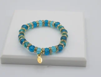 Turquoise Murano glass bead stretch bracelet with bling and a charm