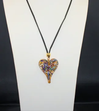 Murano muti color lampworked heart in abstract style. on a bed of gold Murano glass on a black silk cord