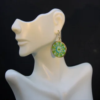Green and yellow millefiori earring in gold setting on French wires nickel free on display