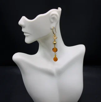 Murano long drop amber tone earrings. Four different types of Murano glass on a three inch drop with additional small glass detail in between them.