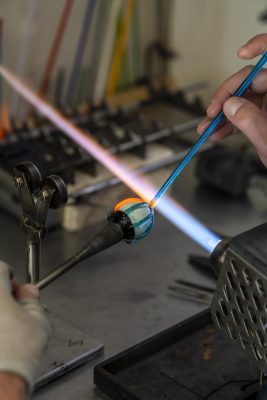 Flamework photo of bead being created in by a Murano artisan