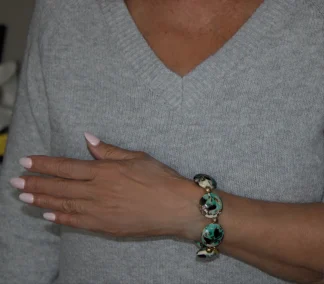 Murano bracelet aqua color on cream color beads stretch bracelet with gold details on wrist