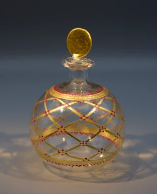 Murano blown glass delicate round scent or perfume bottle with gold lattice design, dotted with red.