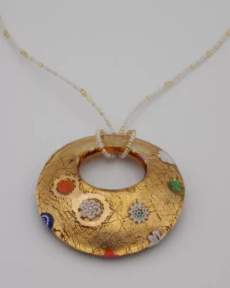 gold Murano glass circular pendant with scattered millefiori decoration on a seed bead cord