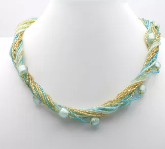 Sparkling gold and turquoise seed beads on 16 separate strands twist create a stunning look with turquoise round Murano beads interspersed